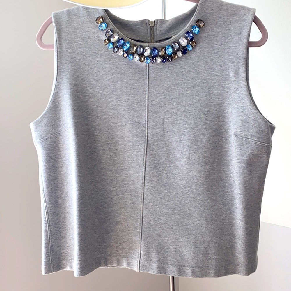 Grey knit top with beaded collar.